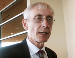 FILE - In this March 15, 2017, file photo, Wisconsin State Superintendent Tony Evers talks with reporters in Madison, Wis. Attorneys for Evers are trying to persuade the state Supreme Court to let them defend their boss in a dispute over the extent of his powers rather than Attorney General Brad Schimel. The Wisconsin Institute for Law and Liberty filed a lawsuit directly with the high court in 2017 arguing Evers is writing regulations without permission from Republican Gov. Scott Walker's administration. Walker has ordered Schimel to represent Evers even though Schimel agrees with WILL. (AP Photo/Scott Bauer, File)