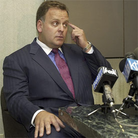 Attorney Todd Macaluso speaks during a news conference in 2000 in Santa Monica, Calif. Macaluso, a disbarred lawyer who represented Casey Anthony, was sentenced Thursday to 15 years in prison for conspiring to fly a plane filled with $13 million worth of cocaine from Ecuador to Honduras. (AP File Photo/Nick Ut)