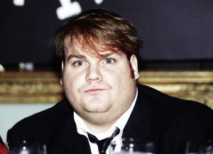 FILE - In this Sept. 18, 1990, file photo, comedian Chris Farley, a new cast member of NBC's "Saturday Night Live" appears in New York. Farley's family has filed a federal lawsuit against Trek Bicycle for naming its fat-tired bikes Farley. The lawsuit alleges that the Wisconsin-based bike company misappropriated Farley's name and traded on his "fat guy" brand of comedy in 2013 when it gave the Farley name to its new fat-tired bikes. (AP Photo/Richard Drew, File)