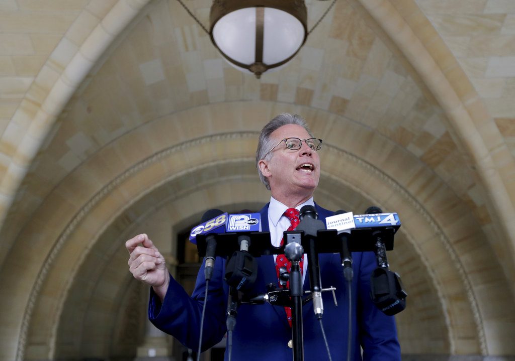 Attorney Mark Thomsen, representing Milwaukee Bucks rookie Sterling Brown, speaks with reporters outside City Hall in Milwaukee, Tuesday, June 19, 2018. Brown is suing the city and its police department because officers used a stun gun on him during his arrest for a parking violation in January. Thomsen filed the lawsuit in federal court Tuesday alleging excessive force and unlawful arrest. (Mike De Sisti/Milwaukee Journal-Sentinel via AP)