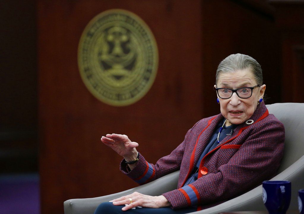FILE - In this Jan. 30, 2018 file photo, U.S. Supreme Court Justice Ruth Bader Ginsburg answers a law student's question as she participates in a "fireside chat" in the Bruce M. Selya Appellate Courtroom at the Roger William University Law School in Bristol, R.I. Ginsburg has received a lifetime achievement award from a prominent Jewish organization. (AP Photo/Stephan Savoia, File)