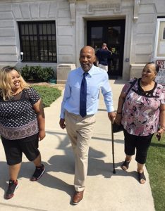 Perry Lott, center, smiles as he leaves court Monday in Oklahoma City, with his daughter, Candace Brown, left, and Antoinette Brown, who was his fiance at the time he was arrested, after being freed from prison when the Innocence Project presented DNA evidence it says excluded him from the crime. Lott was sentenced in 1988 to more than 200 years for rape, robbery, burglary and making a bomb threat related to a 1987 attack. He had spent more than 30 years in prison. (Karen Thompson/Innocence Project via AP)