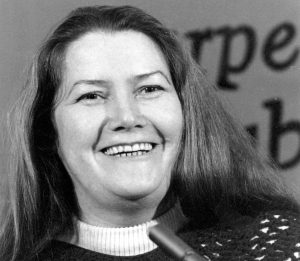 FILE - In this March 1, 1977, file photo, Australian author Colleen McCullough laughs during a news conference in New York. An Australian judge ruled on Friday, July 20, 2018 that best-selling author Colleen McCullough's widower was the sole beneficiary of her estate following a bitter court wrangle. (AP Photo/File)