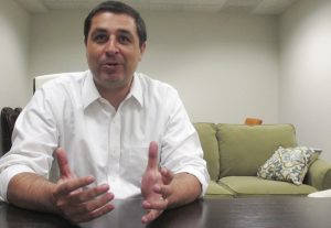 Wisconsin Democratic attorney general candidate Josh Kaul speaks during an interview Wednesday, July 11, 2018, in Madison, Wisc. Kaul is challenging Republican Attorney General Brad Schimel to eight debates in each of the state's congressional districts he said Wednesday. (AP Photo/Scott Bauer)