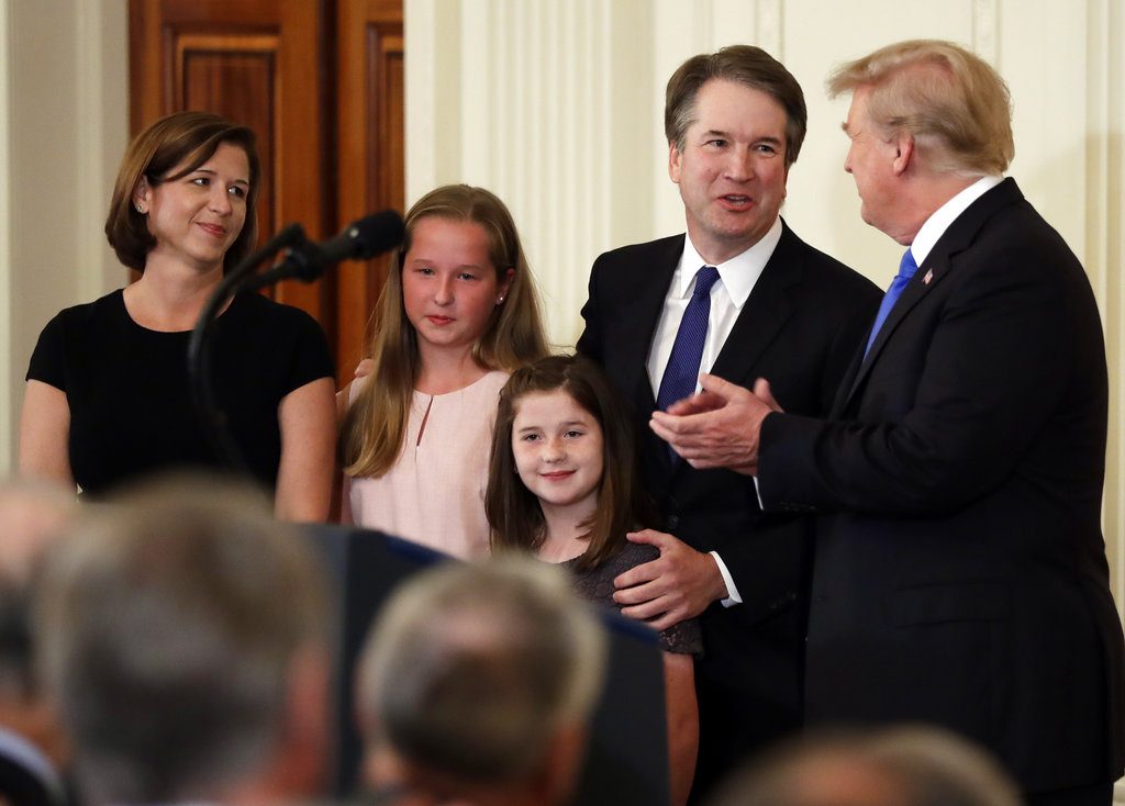 President Donald Trump greets Judge Brett Kavanaugh his Supreme Court nominee, in the East Room of the White House, Monday, July 9, 2018, in Washington. (AP Photo/Evan Vucci)