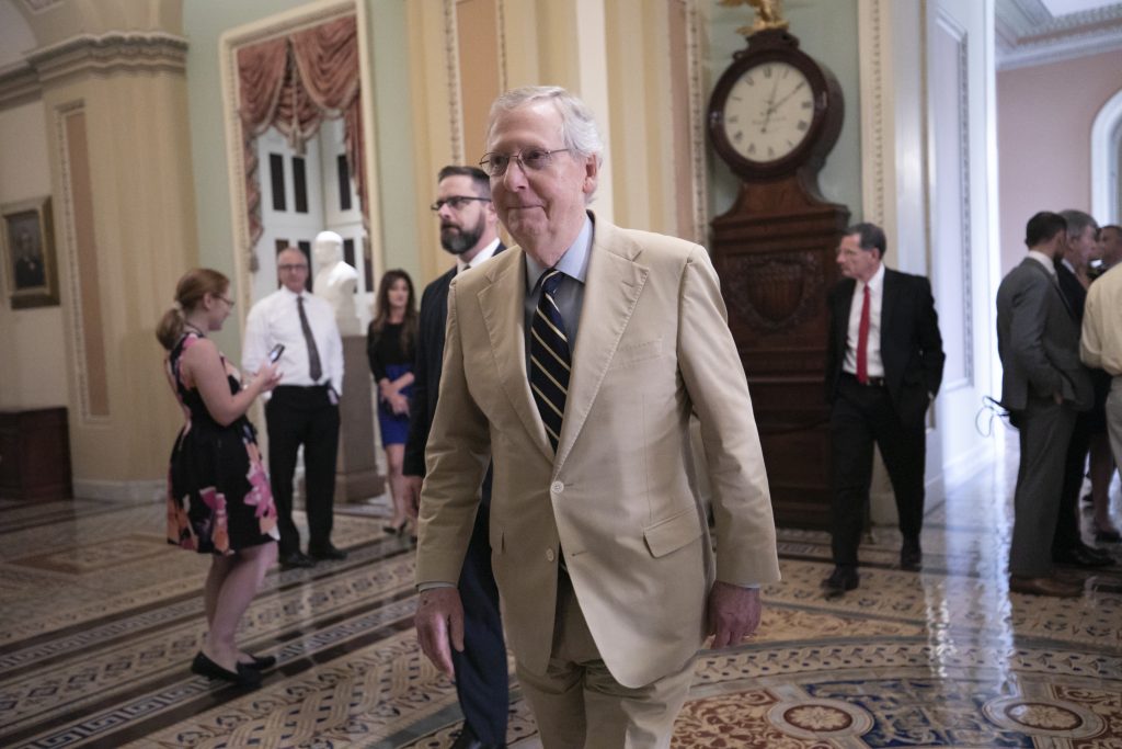 Senate Majority Leader Mitch McConnell, R-Ky., arrives at the chamber to begin work on a judicial confirmation, at the Capitol in Washington, Thursday, Aug. 16, 2018. (AP Photo/J. Scott Applewhite)