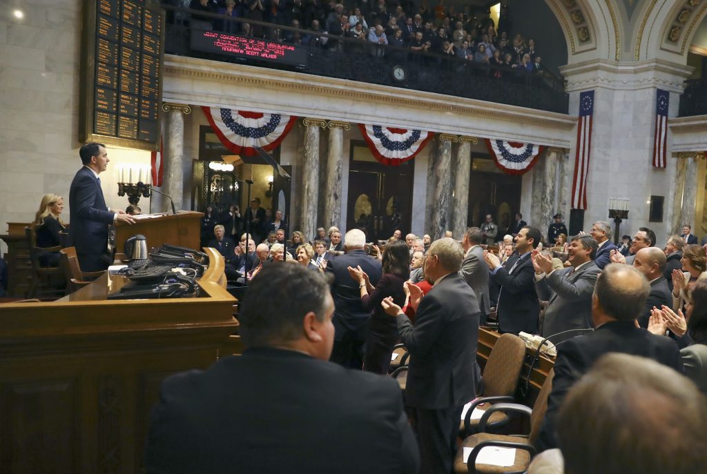In this Jan 24, 2018, photo provided by the Wisconsin Center for Investigative Journalism, Wisconsin Gov. Scott Walker delivers his state of the state address at the state Capitol in Madison. An investigation by the Wisconsin Center for Investigative Journalism has found that since Walker was elected, the length of time bills are deliberated in the Wisconsin Legislature dropped significantly as lawmakers increasingly fast-tracked bills. (Coburn Dukehart/Wisconsin Center for Investigative Journalism via AP)