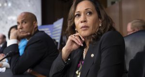 Sen. Kamala Harris, D-Calif., and Sen. Cory Booker, D-N.J., left, pause as protesters disrupt the confirmation hearing of President Donald Trump's Supreme Court nominee, Brett Kavanaugh, on Capitol Hill in Washington, Tuesday, Sept. 4, 2018. (AP Photo/J. Scott Applewhite)