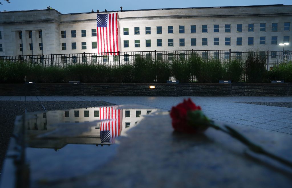 A U.S. flag is unfurled at sunrise on Tuesday at the Pentagon on the 17th anniversary of the Sept. 11, 2001, terrorist attacks. (AP Photo/Pablo Martinez Monsivais)