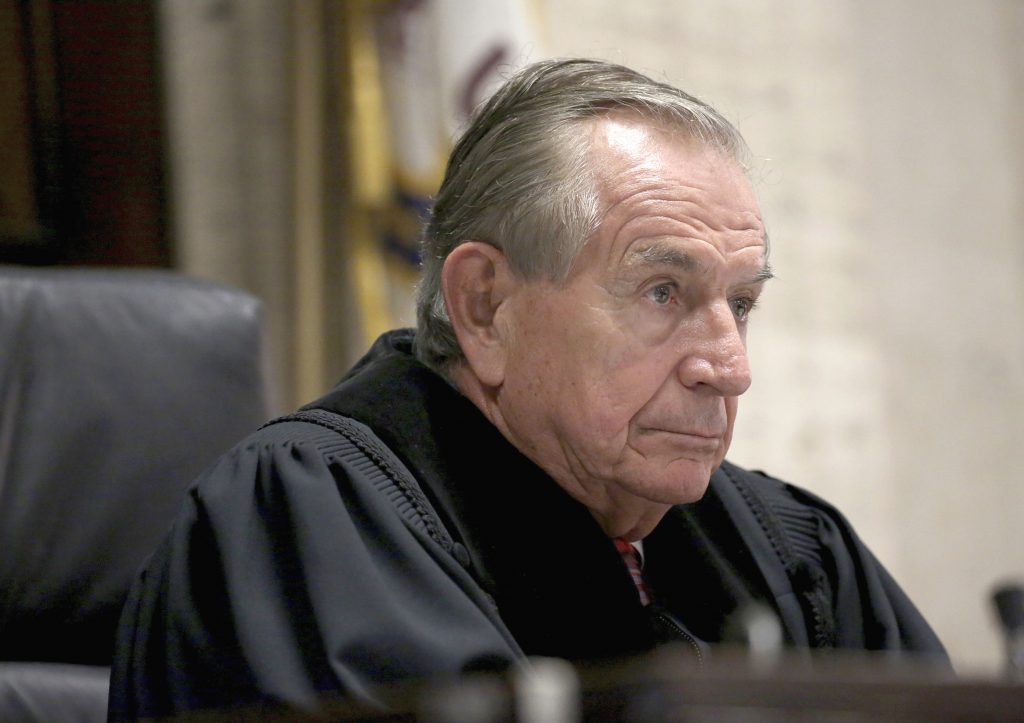 FILE - In this Aug. 4, 2016, file photo, Cook County Judge Vincent Gaughan presides over a hearing at the Leighton Criminal Courts Building in Chicago for Jason Van Dyke, a Chicago police officer charged with murder in the 2014 shooting of black teenager Laquan McDonald. He's presided over some of the biggest trials in recent Chicago history _ from a mass murder case to that of R& B singer R. Kelly on child pornography charges. Now Gaughan is at the center of one of the city's biggest trials in decades. The trial caps a career and a life that have included chapters as an engineering student, war hero, young man who had his own brush with the law, attorney and judge. (Nancy Stone/Chicago Tribune, Pool, File)