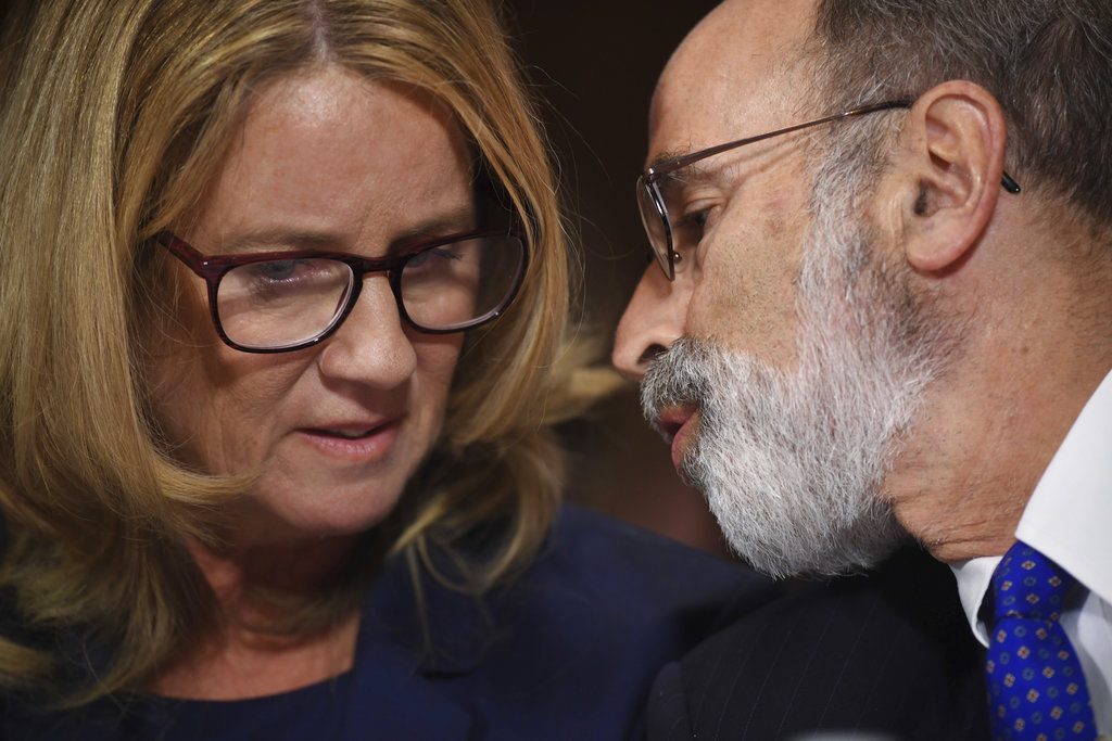 Christine Blasey Ford listens to her attorney Michael Bromwich as she testifies to the Senate Judiciary Committee on Capitol Hill in Washington, Thursday, Sept. 27, 2018. (Saul Loeb/Pool Photo via AP)