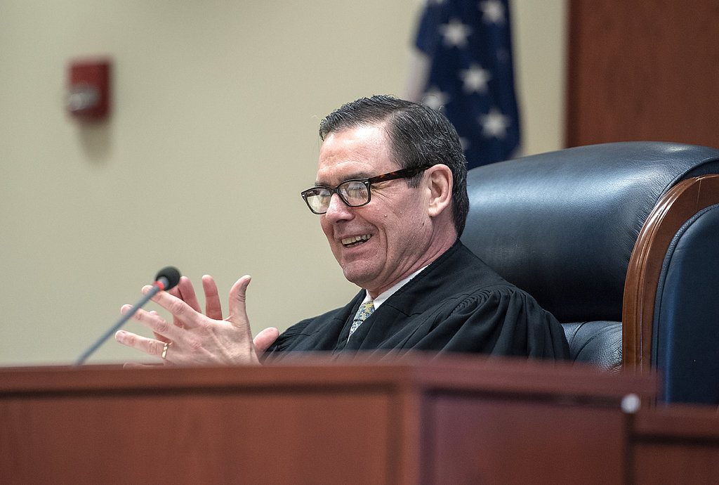 In an April 26 photo, Judge David Reddy applauds during Patrick Weingandt's drug court graduation at the Walworth County Judicial Center in Elkhorn. Earlier in the day, Reddy had kicked drug court participant Hailey Beles out of the courtroom. (Anthony Wahl/The Janesville Gazette via AP)