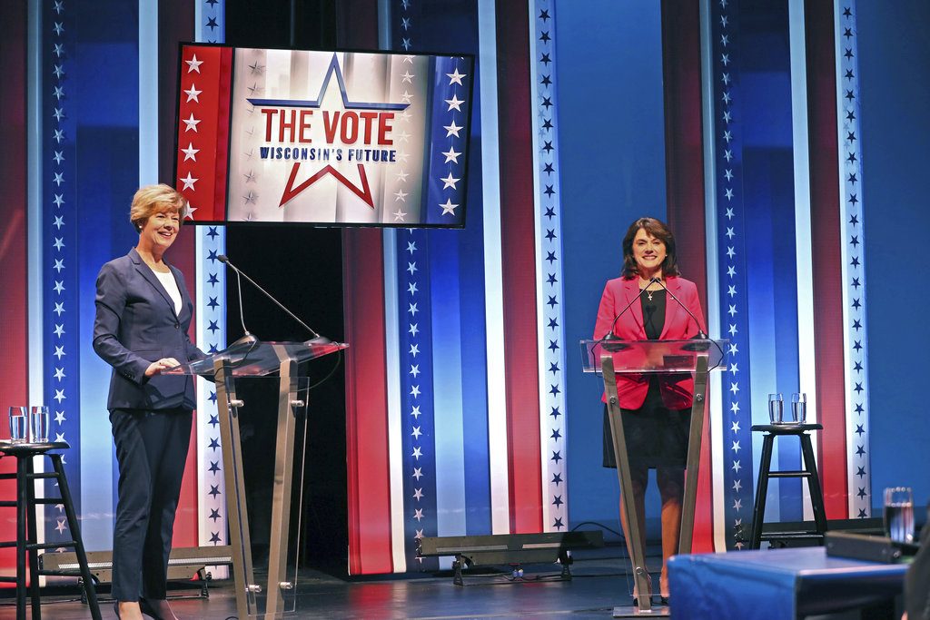 Democratic Sen. Tammy Baldwin, left, and Republican challenger Leah Vukmir, right, stand onstage before the start of the U.S. Senate debate at the University of Wisconsin-Milwaukee campus Monday, Oct. 8, 2018, in Milwaukee. (Michael Sears/Milwaukee Journal-Sentinel via AP)