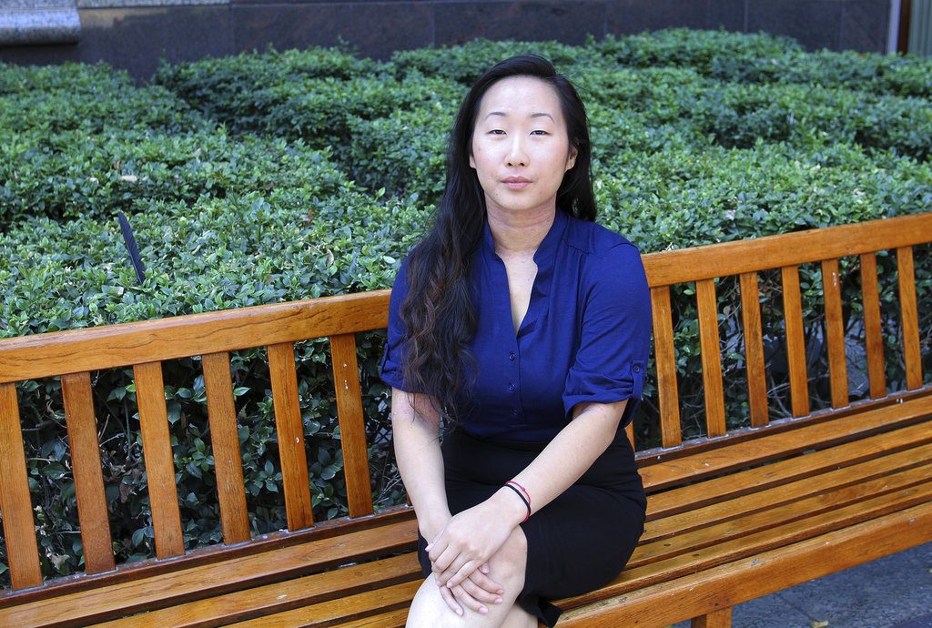 FILE - In this Aug. 12, 2016, file photo, Yee Xiong sits for a photo in Sacramento, Calif. A jury has awarded more than $150,000 in damages to the California woman whose 2012 campus assault case drew wide attention. Now 26 years old, Xiong calls the verdict a 'huge win' for survivors around the world and shows that people can be held accountable, not matter how long it takes. (AP Photo/Darcy Costello, File)