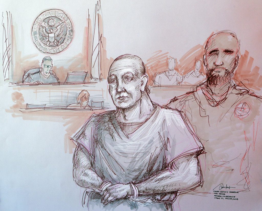 In this courtroom sketch, Cesar Sayoc, left, appears in federal court, Monday, Oct. 29, 2018, in Miami. Sayoc is accused of sending pipe bombs to prominent Democrats around the country. If foreign citizens had mailed pipe bombs to prominent Democrats, or massacred Jews in a synagogue, there’s a good chance they would have been charged with terrorism. But that won’t happen with either of the men charged in the recent wave of mail bombs and the Pittsburgh shootings. That’s because there’s no domestic terrorism law. (Daniel Pontet via AP)