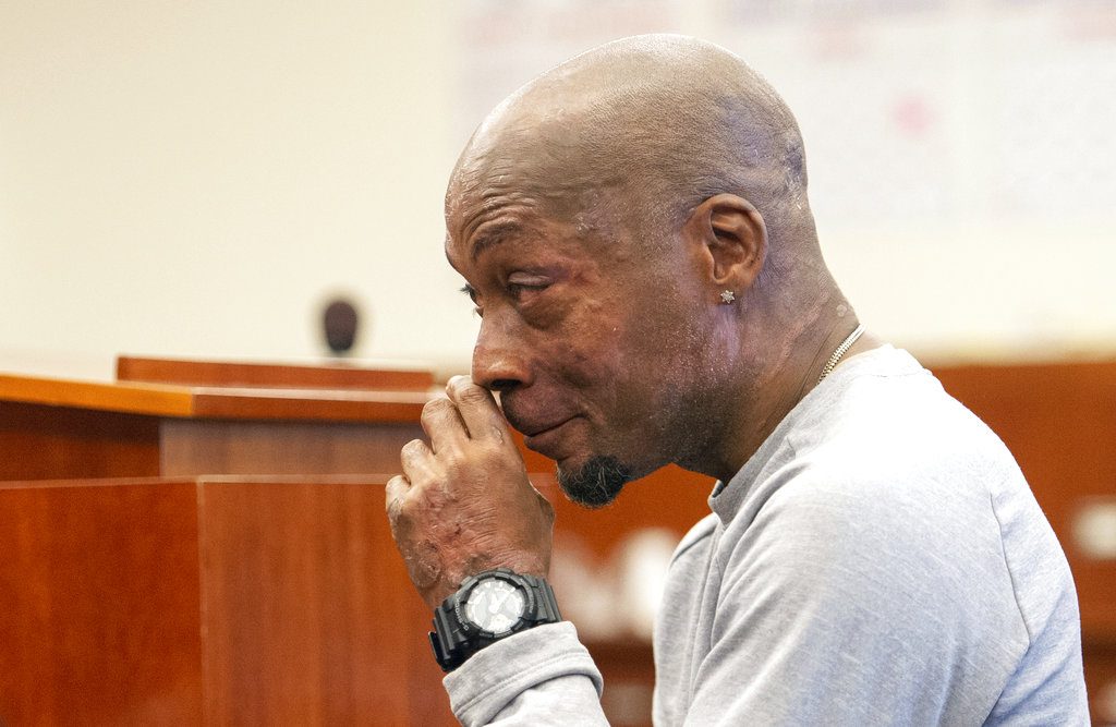 FILE - In this Aug. 10, 2018 file photo, Dewayne Johnson reacts after hearing the verdict in his case against Monsanto at the Superior Court of California in San Francisco. A Northern California groundskeeper says he will accept a judge's reduced verdict of $78 million against Monsanto after a jury found the company's weed killer caused his cancer. DeWayne Johnson's attorney informed the San Francisco Superior Court on Wednesday, Oct. 31, 2018. (Josh Edelson/Pool Photo via AP, File)