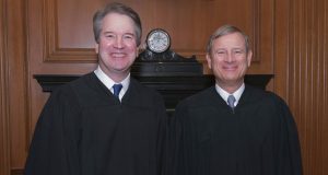 This image provided by the U.S. Supreme Court show Associate Justice Brett M. Kavanaugh, left and Chief Justice John G. Roberts, Jr. in the Justices' Conference Room before a investiture ceremony Thursday, Nov. 8, 2018, at the Supreme Court in Washington. (Fred Schilling/Collection of the Supreme Court of the United States via AP)