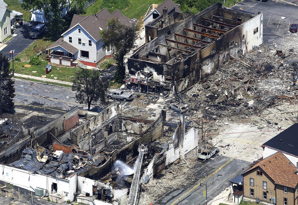 FILE - This July 11, 2018, file photo, shows the aftermath of a gas explosion in downtown Sun Prairie, Wis. Police in Sun Prairie are planning to announce Thursday, Dec. 20, the results of a criminal investigation into an explosion that leveled a city block and killed a firefighter. (John Hart/Wisconsin State Journal via AP, File)