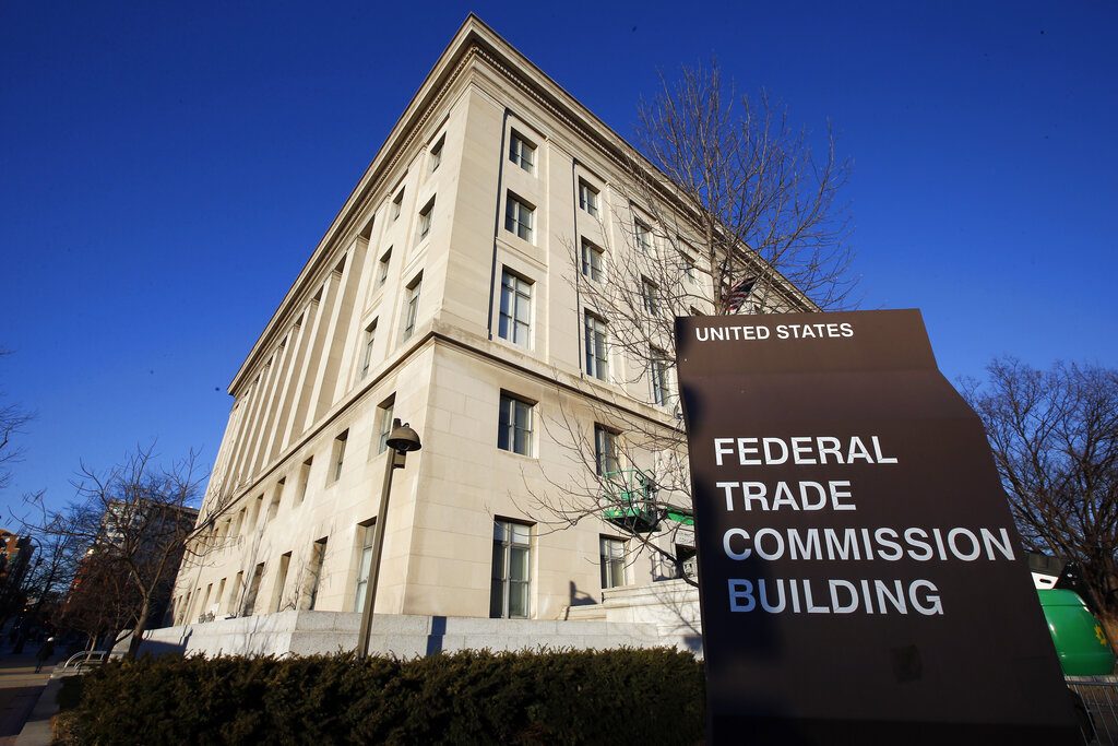 FILE - This Jan. 28, 2015, file photo, shows the Federal Trade Commission building in Washington. Consumer advocates and the data-hungry technology industry are drawing early battle lines in advance of an expected fight over a national privacy law. Privacy organizations on Thursday, Jan. 17, 2019, suggested sidelining the Federal Trade Commission with a new data-protection agency empowered to police U.S. industry. (AP Photo/Alex Brandon, File)
