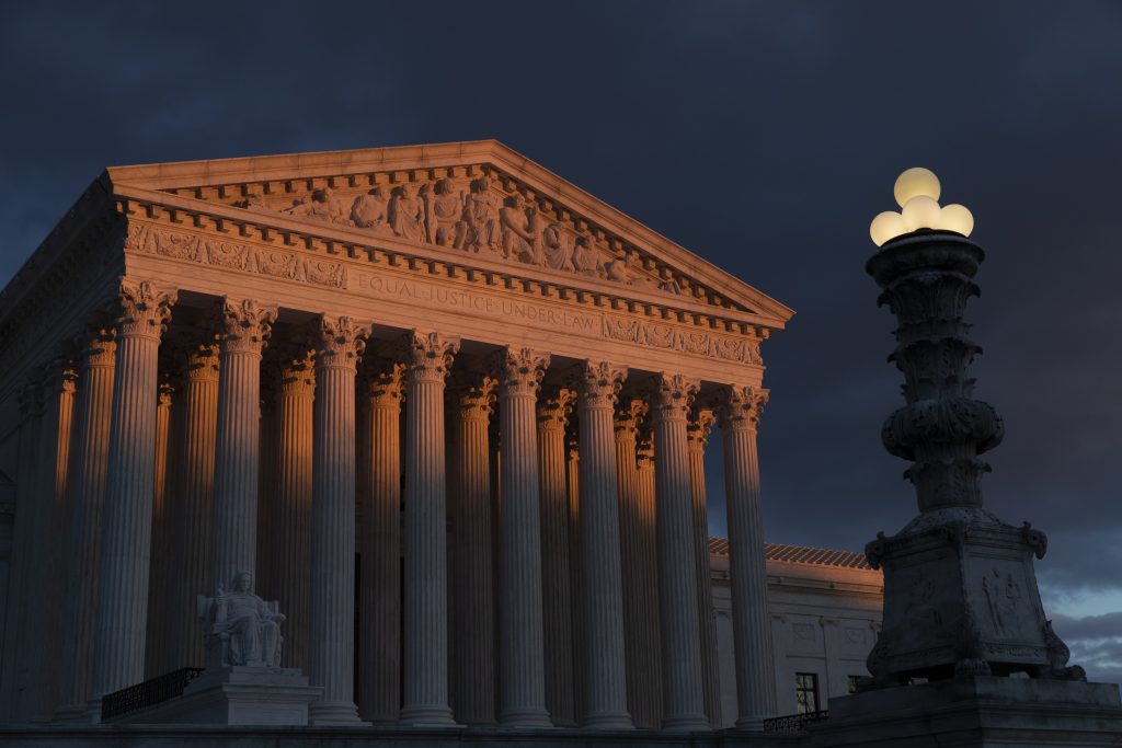 FILE - In this Jan. 24, 2019, file photo, the Supreme Court is seen at sunset in Washington. A long-delayed disaster aid bill that’s a top political priority for some of President Donald Trump’s GOP allies is facing a potentially tricky path as it heads to the Senate floor this week. Although the measure has wide backing from both parties, the White House isn’t pleased with the bill and is particularly opposed to efforts by Democrats to make hurricane relief to Puerto Rico more generous. (AP Photo/J. Scott Applewhite, File)