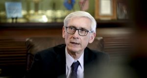 Wisconsin Gov. Tony Evers talks to reporters at the state Capitol on Thursday after a Dane County judge blocked the so-called lame-duck laws that Republicans passed in December to limit the power of the governor and attorney general, both Democrats. (Steve Apps/Wisconsin State Journal via AP)