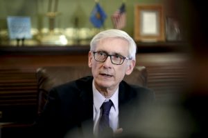 Wisconsin Gov. Tony Evers talks to reporters at the state Capitol on Thursday after a Dane County judge blocked the so-called lame-duck laws that Republicans passed in December to limit the power of the governor and attorney general, both Democrats. (Steve Apps/Wisconsin State Journal via AP)