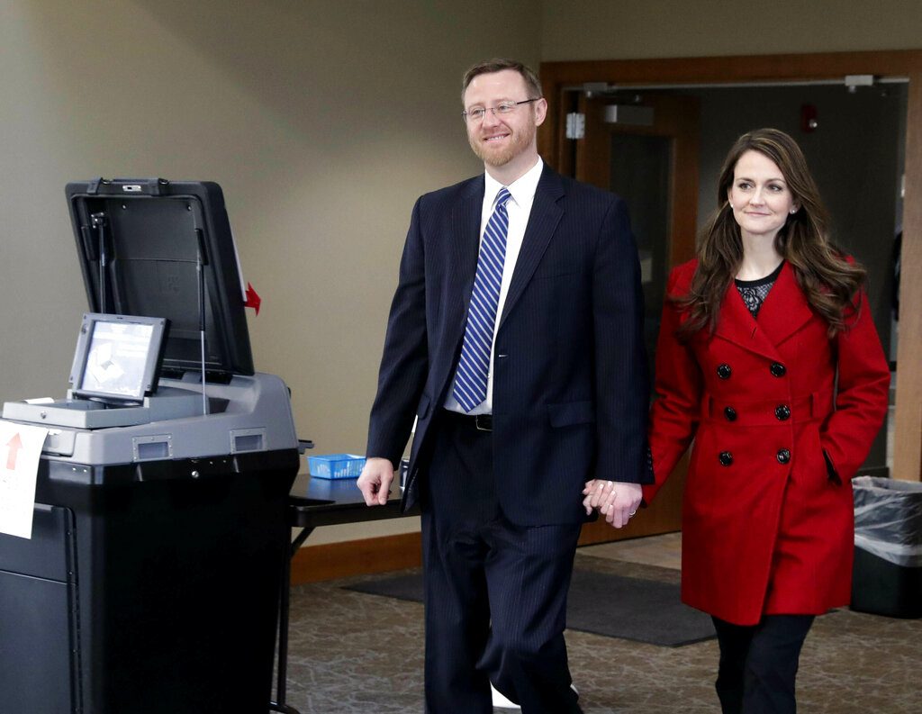 Judge Brian Hagedorn and Christina Hagedorn cast their votes Tuesday in the Town of Summit. The Wisconsin Supreme Court race is a judicial showdown between two state Appeals Court judges, Lisa Neubauer and Brian Hagedorn. (Rick Wood/Milwaukee Journal-Sentinel via AP)