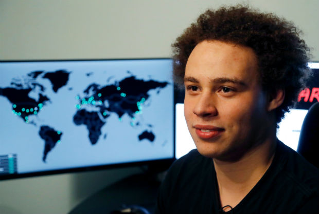 Marcus Hutchins, a British cybersecurity expert hailed as a hero for stopping a worldwide computer virus in 2017, has pleaded guilty to developing malware to steal banking information.(AP Photo/Frank Augstein, File)