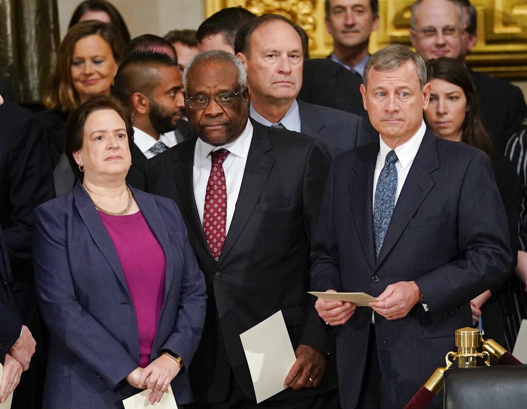 FILE - In this Dec. 3, 2018, file photo, from left, Supreme court Associate Justices Elena Kagan, Clarence Thomas, Samuel Alito and Chief Justice John Roberts arrive for services for former President George H.W. Bush at the U.S. Capitol in Washington. Thomas is now the longest-serving member of a court that has recently gotten more conservative, putting him in a unique and potentially powerful position, and he’s said he isn’t going away anytime soon. With President Donald Trump’s nominees Neil Gorsuch and Brett Kavanaugh now on the court, conservatives are firmly in control as the justices take on divisive issues such as abortion, gun control and LGBT rights. (AP Photo/Pablo Martinez Monsivais, File)