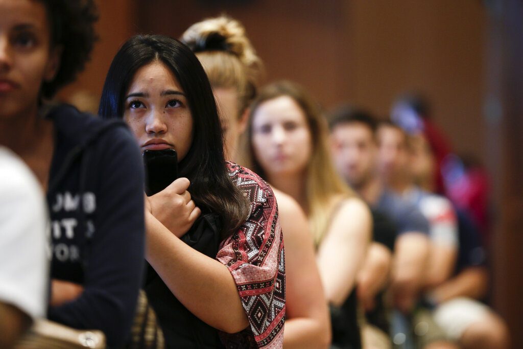 FILE - In this Friday, Aug. 1, 2014 file photo, new students at San Diego State University watch a video on sexual consent during an orientation meeting in San Diego. Just what constitutes an expression of consent is a hotly debated topic in the justice system and in society at large. And while there’s been a gradual cultural trend, especially on university campuses, toward a standard of “affirmative consent” _ otherwise known as “yes means yes” rather than “no means no” _ the laws on sexual assault have not similarly evolved. (AP Photo/Gregory Bull)