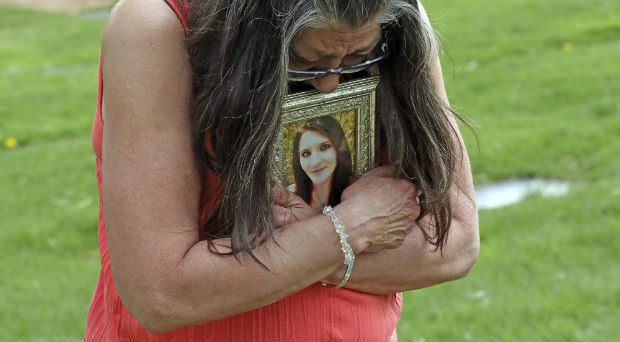 Melany Zoumadakis clutches a photo of her daughter, Tanna Jo Fillmore, on April 26 in Salt Lake City. Fillmore killed herself in the Duchesne County Jail in 2016, after repeatedly calling her mother, saying she was being denied her prescription medicines. Her mother has filed a lawsuit. (AP Photo/Rick Bowmer)