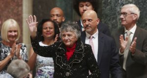 Supreme Court Justice Shirley Abrahamson, with her son, Daniel Abrahamson, right center, his wife, Tsan, and their son, Moses, 15, greets a crowd during a celebration in her honor in the rotunda at the Wisconsin State Capitol in Madison, Wis., Tuesday, June 18, 2019. Also standing with Abrahamson is Gov. Tony Evers, right, his wife, Kathy, left, and Lt. Gov. Mandela Barnes. (Amber Arnold/Wisconsin State Journal via AP)