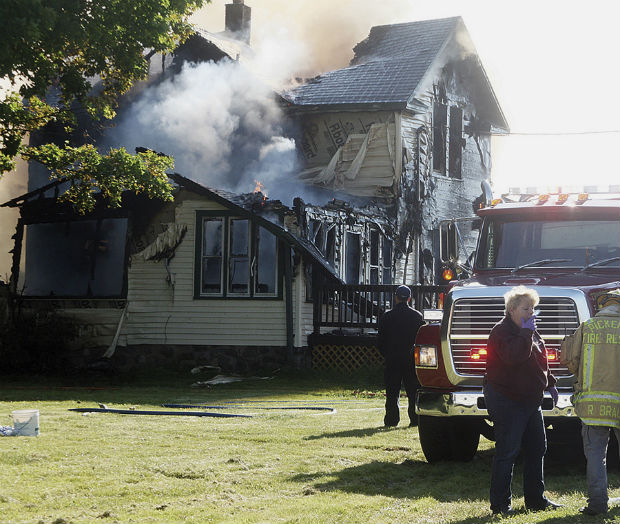 Responders work the scene of a deadly house fire in Pickerel on Tuesday. Authorities say several people, including four children, died in the house fire. (Antigo Daily Journal via AP)