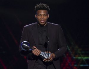 The NBA player Giannis Antetokounmpo of the Milwaukee Bucks accepts an award for best male athlete at the ESPY Awards on July 10 at the Microsoft Theater in Los Angeles. (Photo by Chris Pizzello/Invision/AP)