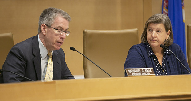 Kelly Mitchell, right, chair of the Sentencing Guidelines Commission, listens as Executive Director Nate Reitz offers guidance during a July 18 hearing. (Photo by Kevin Featherly)