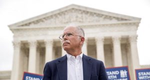 FILE - In this Wednesday, June 27, 2018, file photo, plaintiff Mark Janus stands outside the Supreme Court after the court rules in a setback for organized labor that states can't force government workers to pay union fees, in Washington. Union membership among public employees has fallen only slightly in the nation’s most unionized states since the Supreme Court ruled in 2018 that government workers no longer could be required to pay union fees, according to an analysis of federal data conducted for The Associated Press. (AP Photo/Andrew Harnik, File)