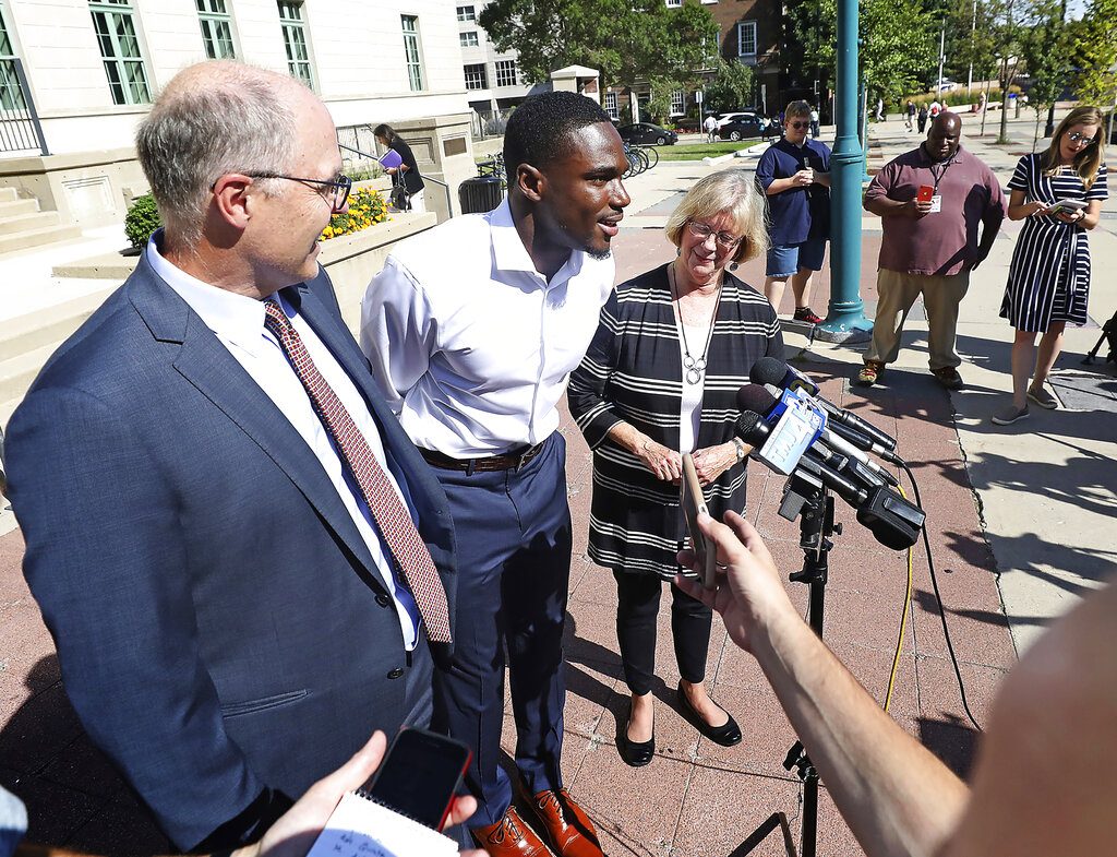 Wisconsin Badger football player Quintez Cephus speaks during a press conference outside the Madison Municipal Building addressing his reinstatement to the university in Madison, Wis. Monday, Aug. 19, 2019. He is pictured with his attorneys, Stephen Meyer and Kathleen Stilling. The university expelled Cephus last semester for violating the non-academic misconduct code following accusations of sexual assault from two women. A Dane County jury acquitted him of those charges earlier this month after deliberating for less than an hour. (John Hart/Wisconsin State Journal via AP)