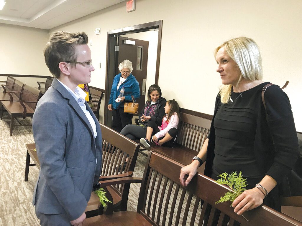 In a June 30, 2019 photo, Megan Treuer, left, the chief judge for the Bois Forte Tribal Court,  meets with Sixth District Judge Michelle Anderson at the ribbon-cutting celebration of the new tribal courthouse in Nett Lake, Minn.  (Eric Killelea/The Daily Tribune via AP)