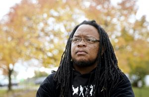 Marlon Anderson stands on Oct. 17 in Madison. A Wisconsin school district is rehiring Anderson, a security guard, after he was fired last week for repeating a racial slur while telling a student not to use it. (Steve Apps/Wisconsin State Journal via AP)