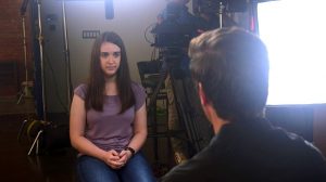 Payton Leutner, left, is interviewed by David Muir of ABC in August. Leutner survived a stabbing attack in 2014 committed by two teenage friends who wanted to please a fictional horror character called Slender Man. In her first interview about the attack, which is to air on Friday,  Leutner told ABC News that despite her lingering trauma, she has "come to accept all of the scars that I have." (ABC News via AP)