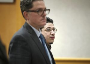Julian Collazo and the defense attorney Jeffrey Jensen watch as jurors walk out after a mistrial was declared Thursday by Rock County Judge Barbara McCrory because of the jury's inability to reach a decision.  (Anthony Wahl/The Janesville Gazette via AP)