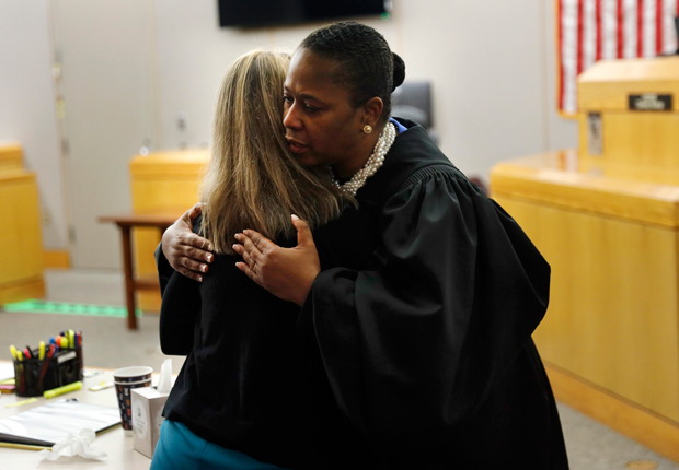 Judge Tammy Kemp hugs former Dallas police officer Amber Guyger