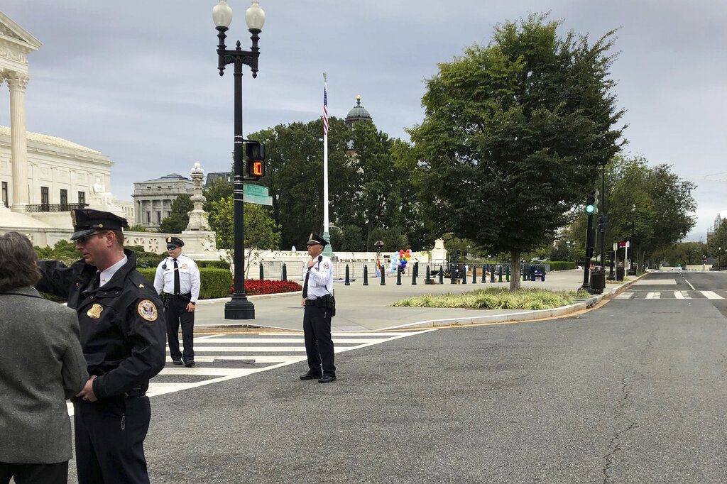 The streets outside the front of the Supreme Court are closed off for a suspicious package, Tuesday morning, Oct. 8, 2019 in Washington. (AP Photo/Mark Sherman)