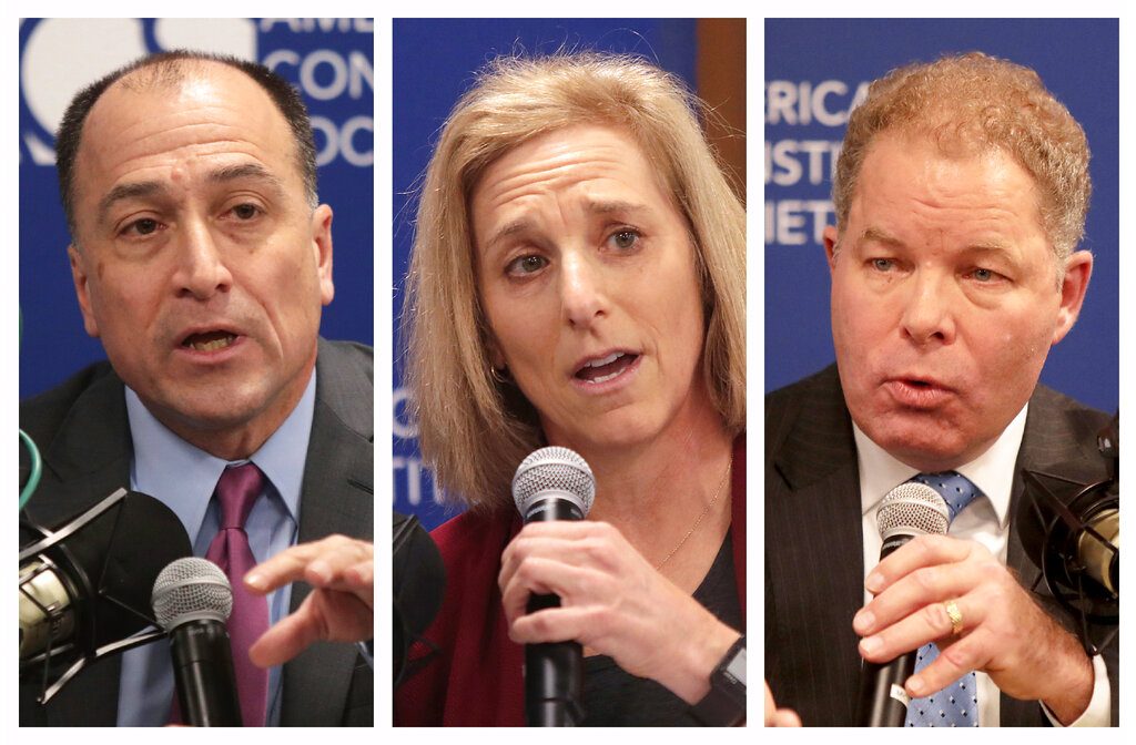 This combination of Nov. 19, 2019 photos shows Marquette University Law Professor Ed Fallone, left, Dane County Circuit Court Judge Jill Karofsky, center, and Wisconsin Supreme Court Justice Daniel Kelly, during a candidate's forum for a seat on the state Supreme Court. On Tuesday, Feb. 18, 2020 voters will narrow the field from three to two for the general election in April. (John Hart/Wisconsin State Journal via AP, File)