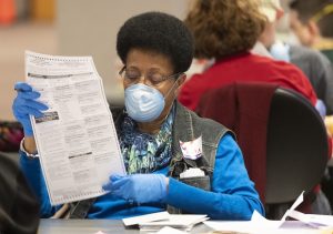 City of Milwaukee Election Commission workers process absentee ballots on April 7 in downtown Milwaukee. (Mark Hoffman/Milwaukee Journal-Sentinel via AP)