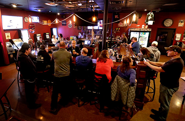 The Dairyland Brew Pub in Appleton opens following the Wisconsin Supreme Court’s decision on May 13 to strike down the safer-at-home order Gov. Tony Evers imposed in response to the coronavirus outbreak. As local governments slowly allow businesses to re-open throughout the state, owners are finding themselves faced with a host of questions pertaining to legal and insurance matters. (William Glasheen/The Post-Crescent via AP)