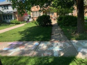 Chalk message on sidewalk in front of Attorney Stephanie Rapkin's home