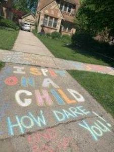 Chalk message on sidewalk in front of Attorney Stephanie Rapkin's home