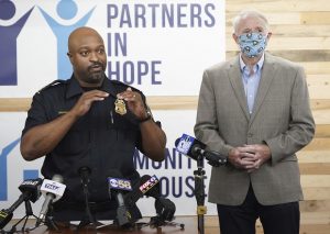 Acting Milwaukee Police Chief Michael Brunson, left, talks as Mayor Tom Barrett looks on during a press conference announcing a new Milwaukee Police Department-led initiative to improve police-community relations, at the Community Warehouse, in Milwaukee on Wednesday. (Mike De Sisti/Milwaukee Journal-Sentinel via AP)