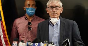Wisconsin Governor Tony Evers speaks during a news conference 
on Thursday in Kenosha. The city has suffered from unrest in the wake of the police shooting of Jacob Blake. Lt. Gov. Mandela Barnes is at rear. (AP Photo/Morry Gash)